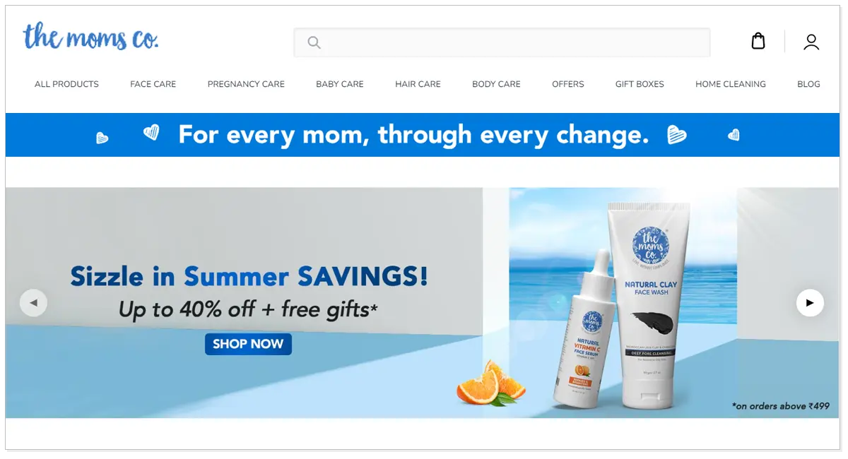 The Moms Co. with sliced orange and product of The Mom Co. as well as shop now.