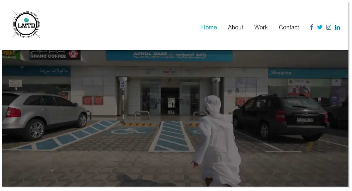 LMTD home page with a picture of a man running towards a shop.