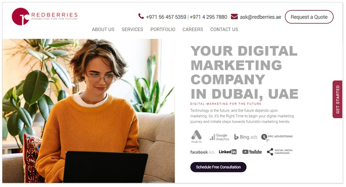 Red Berries home page with the picture of a lady using a laptop sitting on the sofa.