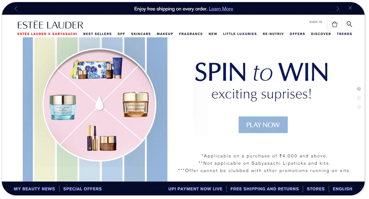 A screenshot of Estee Lauder home page consisting pictures of beauty products and play now button.