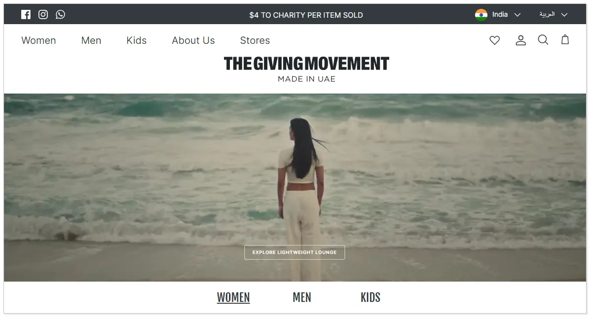 The Giving Movement home page with the picture of a lady standing in front of the sea and looking towards the sea.